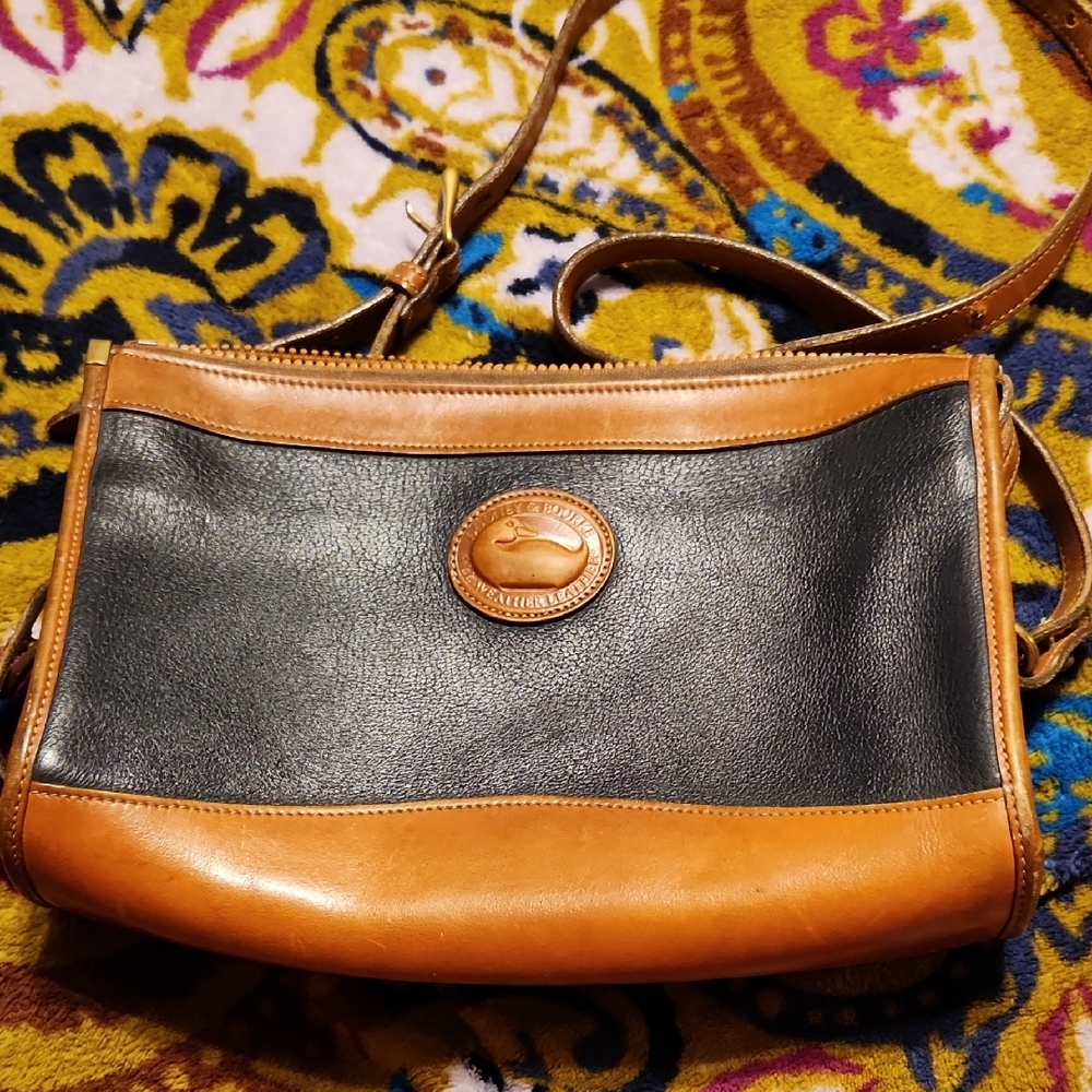 Vintage Dooney And Bourke Bag the purse strap is not included.